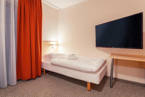 Residence AlpenHeart客房内的一张或多张床位