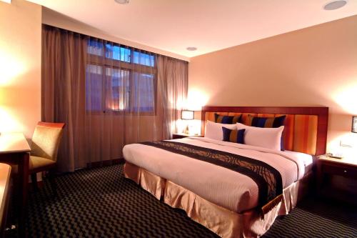 景安精品旅館客房内的一张或多张床位