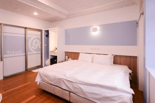 哈密瓜汽车旅馆-竹北馆客房内的一张或多张床位