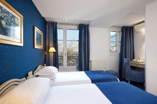 奥斯丁圣拉扎尔酒店客房内的一张或多张床位