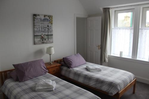 Dunmhor Guest House客房内的一张或多张床位