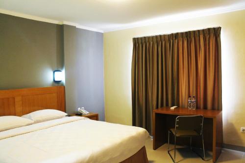 美娜多马洛桑酒店客房内的一张或多张床位