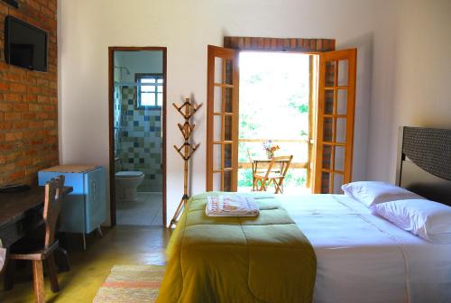 Pousada Fazenda Sant’Ana客房内的一张或多张床位
