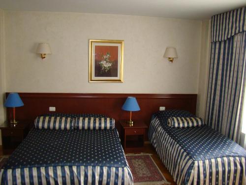 Hotel Vila Ariston客房内的一张或多张床位