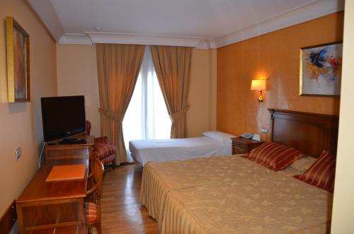 斯考特而瓜迪亚纳酒店客房内的一张或多张床位