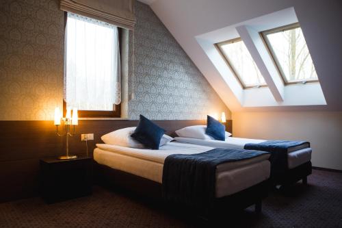 Hotel Cztery Pory Roku客房内的一张或多张床位