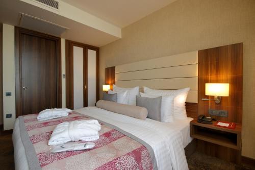 图雅普帕拉斯酒店客房内的一张或多张床位