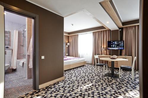 马努法克图拉设计酒店客房内的一张或多张床位