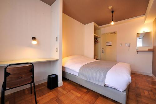 西川口站前可可旅馆客房内的一张或多张床位
