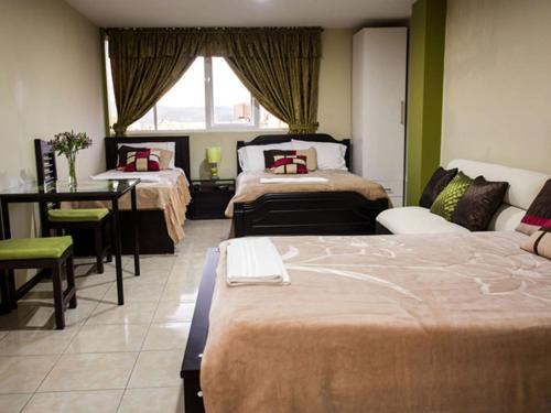 Hotel Las Gardenias客房内的一张或多张床位