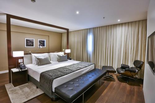 Quality Hotel Flamboyant客房内的一张或多张床位