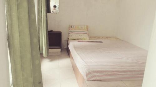 Pari Solata Seaview Homestay Syariah客房内的一张或多张床位