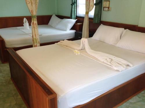 塔诺特贝家庭度假酒店客房内的一张或多张床位
