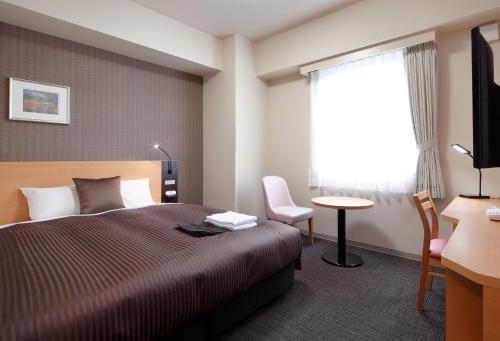 高级特玛日酒店客房内的一张或多张床位