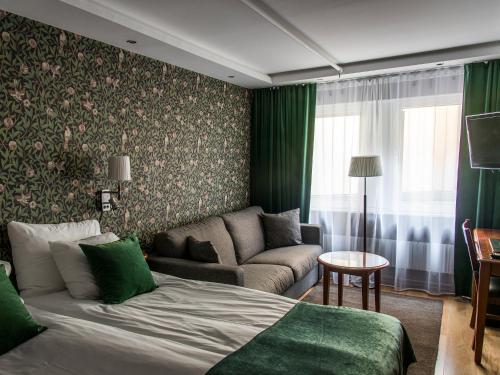 瓦尔贝里斯城市酒店及亚洲Spa客房内的一张或多张床位