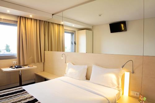 波尔图机场酒店百樂酒店 客房内的一张或多张床位