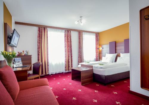 伯格施密特加尼蒂普托普酒店客房内的一张或多张床位