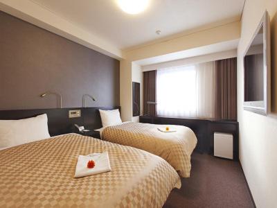 纳凡浜名湖酒店客房内的一张或多张床位