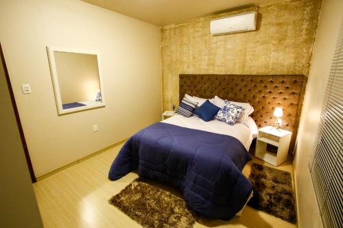 Apartamento Aconchegante Na Serra客房内的一张或多张床位