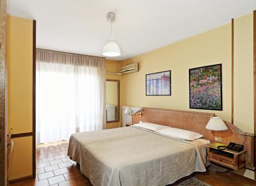 索格诺公寓式酒店客房内的一张或多张床位