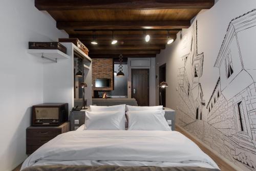 韦里亚Olganos VL Luxury Rooms & Suites的卧室配有一张壁挂式床