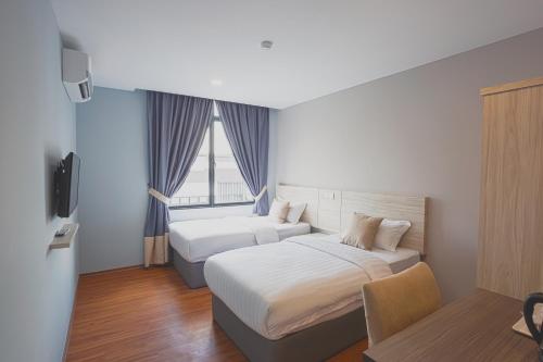 塞里阿兰V3酒店客房内的一张或多张床位