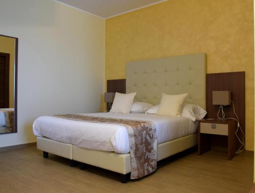 伊甸园公寓式酒店客房内的一张或多张床位