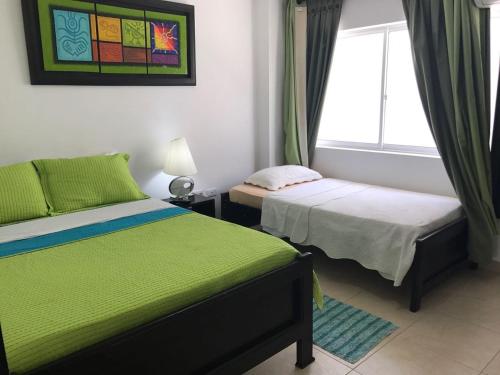 Caribbean Island Hotel piso 1客房内的一张或多张床位