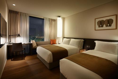海云台新罗酒店客房内的一张或多张床位