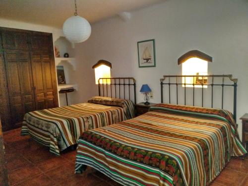 Casas Rurales Encarnita客房内的一张或多张床位
