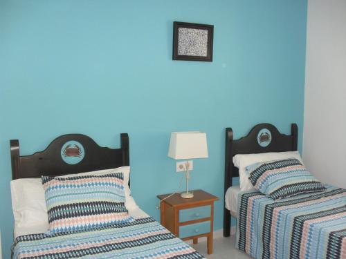 Aloja Puerto Deportivo客房内的一张或多张床位
