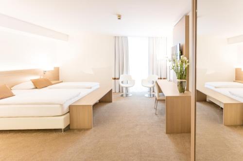 慕尼黑雷莱克萨酒店客房内的一张或多张床位