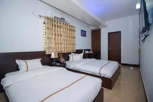 普罗加提酒店有限公司客房内的一张或多张床位