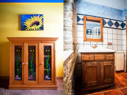 Caboalles de Abajo卡萨农村邦戈旅馆的一间带水槽的浴室和一个带镜子的橱柜