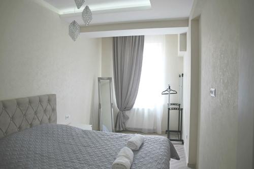 The Pearl of Mtatsminda Apartments客房内的一张或多张床位