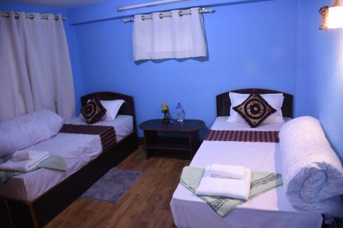 Subha Guest House客房内的一张或多张床位
