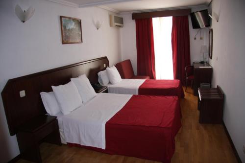 米兰达图里斯莫酒店客房内的一张或多张床位
