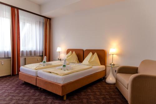 斯驰维尔特尔布劳城市酒店客房内的一张或多张床位