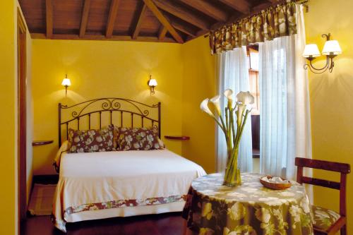 萨尔瓦多卡萨乡村酒店客房内的一张或多张床位
