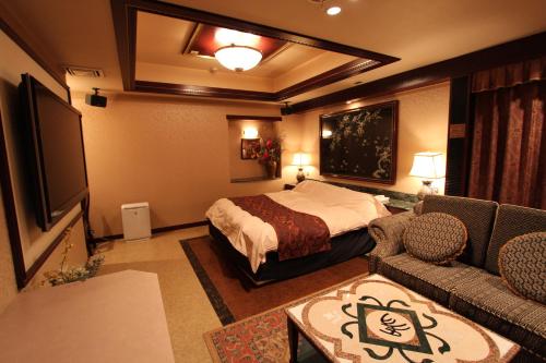 拉拉酒店（仅限成人）客房内的一张或多张床位