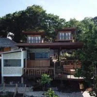特瓦纳礁石度假屋，位于比拉的酒店