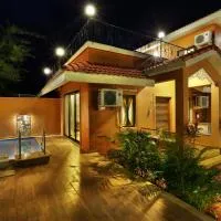 SaffronStays Nithyam - 2BR budget pool villa in Wada, gated community, Wi-Fi, river walk, near Mumbai via NH48，位于Pālghar的酒店
