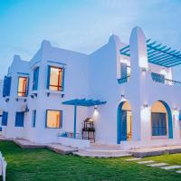 4 bedrooms villa with private pool in Tunis village faiuym，位于Qaryat at Ta‘mīr as Siyāḩīyah的酒店