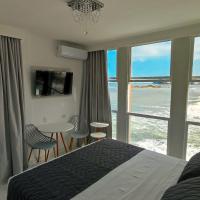 Grand Hotel Guarujá - A sua Melhor Experiência Beira Mar na Praia!，位于瓜鲁雅Pitangueiras的酒店