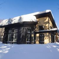 CHALET MISTA - Charlevoix - Repère de ski moderne en nature，位于Saint-Tite-des-Caps的酒店