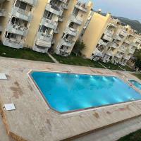 Güzelçamli, Kusadasi Apartment with a pool，位于库萨达斯的酒店