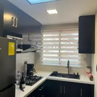 Departamento de 2 Habitaciones, full amoblada con todo para que disfrutes de tu Estancia，位于昆卡的酒店