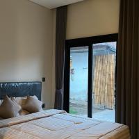 Kubu Gandi Homestay，位于登巴萨伍拉·赖国际机场 - DPS附近的酒店