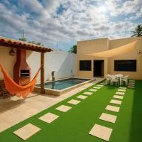 Casa Climatizada com Piscina e Área de Churrasco 400B，位于茹阿泽鲁的酒店