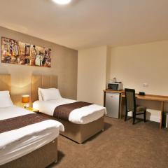 New County Hotel & Serviced Apartments by RoomsBooked